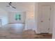 Open-concept living room boasts modern flooring, a ceiling fan, and a view of the front yard at 159 Aztec Se Way, Acworth, GA 30102