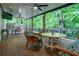 Inviting covered back porch with ceiling fans and comfortable wicker furniture at 3924 Ashford Dunwoody Road Northeast Ne Rd, Atlanta, GA 30319
