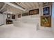Finished basement featuring painted floor and open ceiling at 3924 Ashford Dunwoody Road Northeast Ne Rd, Atlanta, GA 30319