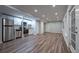 Basement kitchenette with stainless steel appliances and wood-look vinyl floors at 3924 Ashford Dunwoody Road Northeast Ne Rd, Atlanta, GA 30319