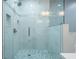 Stylish shower with glass enclosure and white marble tile at 3924 Ashford Dunwoody Road Northeast Ne Rd, Atlanta, GA 30319
