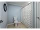 Cozy bathroom with tile flooring, toilet and patterned shower curtain at 3924 Ashford Dunwoody Road Northeast Ne Rd, Atlanta, GA 30319