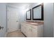 Bathroom with tiled floors, double vanity, and painted wood cabinets at 3924 Ashford Dunwoody Road Northeast Ne Rd, Atlanta, GA 30319