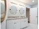 Bathroom with double sink vanity, granite countertop and modern fixtures at 3924 Ashford Dunwoody Road Northeast Ne Rd, Atlanta, GA 30319