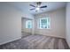 Bedroom with neutral walls, carpet flooring, ceiling fan and a large window at 3924 Ashford Dunwoody Road Northeast Ne Rd, Atlanta, GA 30319