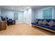 Bedroom featuring hardwood flooring, a desk and a blue futon at 3924 Ashford Dunwoody Road Northeast Ne Rd, Atlanta, GA 30319