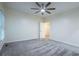 Cozy bedroom with neutral carpeting, ceiling fan, and ample natural light at 3924 Ashford Dunwoody Road Northeast Ne Rd, Atlanta, GA 30319