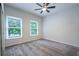 Comfortable bedroom with neutral carpet, ceiling fan, and bright natural light at 3924 Ashford Dunwoody Road Northeast Ne Rd, Atlanta, GA 30319