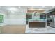 Open-concept kitchen with a large island, stainless steel appliances, and marble flooring at 3924 Ashford Dunwoody Road Northeast Ne Rd, Atlanta, GA 30319
