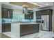 Modern kitchen featuring a large island, stainless steel appliances, and custom cabinets at 3924 Ashford Dunwoody Road Northeast Ne Rd, Atlanta, GA 30319