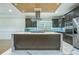 Modern kitchen featuring a large island, stainless steel appliances, and custom cabinets at 3924 Ashford Dunwoody Road Northeast Ne Rd, Atlanta, GA 30319