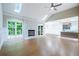 Spacious living room with fireplace, vaulted ceilings, and seamless access to the kitchen at 3924 Ashford Dunwoody Road Northeast Ne Rd, Atlanta, GA 30319