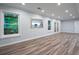 Spacious living room with recessed lighting, wood-look vinyl floors and a backyard view at 3924 Ashford Dunwoody Road Northeast Ne Rd, Atlanta, GA 30319