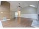 Open living area with vaulted ceilings, hardwood floors, and a modern fireplace at 3924 Ashford Dunwoody Road Northeast Ne Rd, Atlanta, GA 30319
