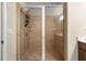 Modern tiled shower with a glass enclosure at 3937 Covey Flush Sw Ct # 25, Smyrna, GA 30082