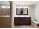 Modern bathroom with double sinks, framed mirrors, and tiled walk-in shower at 3937 Covey Flush Sw Ct # 25, Smyrna, GA 30082