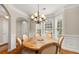 Cozy dining area with natural light, hardwood floors, and elegant chandelier, great for entertaining at 3937 Covey Flush Sw Ct # 25, Smyrna, GA 30082