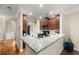 Open kitchen features granite countertops, modern appliances, and seamless flow to other rooms at 3937 Covey Flush Sw Ct # 25, Smyrna, GA 30082