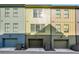 View of townhomes with colorful exteriors, garages, and modern architecture at 720 Perch Pl, Atlanta, GA 30312