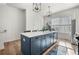 Kitchen with a central island provides ample counter space for cooking and entertaining at 720 Perch Pl, Atlanta, GA 30312