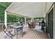 Entertain on this back deck with dining, grilling, and fire pit areas at 10875 Shagbark Trl, Roswell, GA 30075