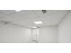 Finished basement featuring finished walls, neutral carpeting, and paneled ceiling at 10875 Shagbark Trl, Roswell, GA 30075