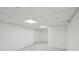 Basement featuring finished walls, neutral carpeting, and paneled ceiling at 10875 Shagbark Trl, Roswell, GA 30075
