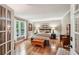 Inviting bedroom with hardwood floors, natural light, and a serene ambiance at 10875 Shagbark Trl, Roswell, GA 30075