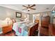 Cozy bedroom showcasing warm wood floors and stylish, eclectic furnishings at 10875 Shagbark Trl, Roswell, GA 30075