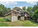 View of the backyard decks and lattice work on this beautiful home at 10875 Shagbark Trl, Roswell, GA 30075