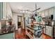 Well-lit kitchen with stainless appliances, granite countertops, and a functional center island at 10875 Shagbark Trl, Roswell, GA 30075