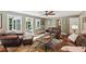 Spacious living room featuring hardwood floors, comfortable seating, and natural light at 10875 Shagbark Trl, Roswell, GA 30075