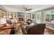 Comfortable living room with brick fireplace and bookshelves, perfect for relaxing at 10875 Shagbark Trl, Roswell, GA 30075