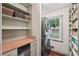 Well-organized pantry with shelving, tiled counters, stainless appliances, and ample storage space at 10875 Shagbark Trl, Roswell, GA 30075