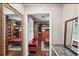 Expansive walk-in closet with custom shelving, wood floors, and stylish decor at 10875 Shagbark Trl, Roswell, GA 30075