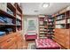 Spacious closet with custom shelving, drawers, and organized storage solutions at 10875 Shagbark Trl, Roswell, GA 30075