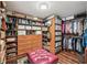 Large walk-in closet featuring custom shelves, drawers, and ample storage space at 10875 Shagbark Trl, Roswell, GA 30075