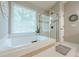 Close up of the bathroom tub and shower at 1245 Mountain Ivey Ct, Sugar Hill, GA 30518