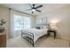 Cozy bedroom with large window and modern decor at 1245 Mountain Ivey Ct, Sugar Hill, GA 30518