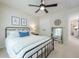 Bedroom with an black metal bed and natural light at 1245 Mountain Ivey Ct, Sugar Hill, GA 30518