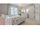 Bedroom with floral bedding and natural light from large window at 1245 Mountain Ivey Ct, Sugar Hill, GA 30518