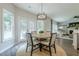 Charming breakfast area with views to the backyard and seamlessly flowing to the living area at 1245 Mountain Ivey Ct, Sugar Hill, GA 30518