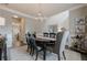 Formal dining room featuring a wood table, neutral colors, and decorative lighting, perfect for entertaining guests at 1245 Mountain Ivey Ct, Sugar Hill, GA 30518