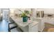 Modern kitchen features white cabinetry, stainless steel appliances, and granite countertops with barstool seating at 1245 Mountain Ivey Ct, Sugar Hill, GA 30518