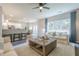 Open-concept living room with views of the kitchen and dining area, offering a seamless flow for modern living at 1245 Mountain Ivey Ct, Sugar Hill, GA 30518