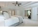 Expansive main bedroom has trey ceilings, neutral decor, and a sitting area near large windows at 1245 Mountain Ivey Ct, Sugar Hill, GA 30518