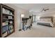 Main bedroom with a dedicated desk space, a cozy bench, and a ceiling fan for added comfort at 1245 Mountain Ivey Ct, Sugar Hill, GA 30518