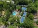 Aerial view of community amenities including swimming pool, tennis courts, and surrounding greenery at 1602 Windsor Walk, Avondale Estates, GA 30002