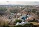 Aerial view of a neighborhood with houses and trees in the background at 1602 Windsor Walk, Avondale Estates, GA 30002