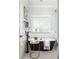 Light-filled bathroom featuring a modern black tub and elegant fixtures, with a window at 1602 Windsor Walk, Avondale Estates, GA 30002
